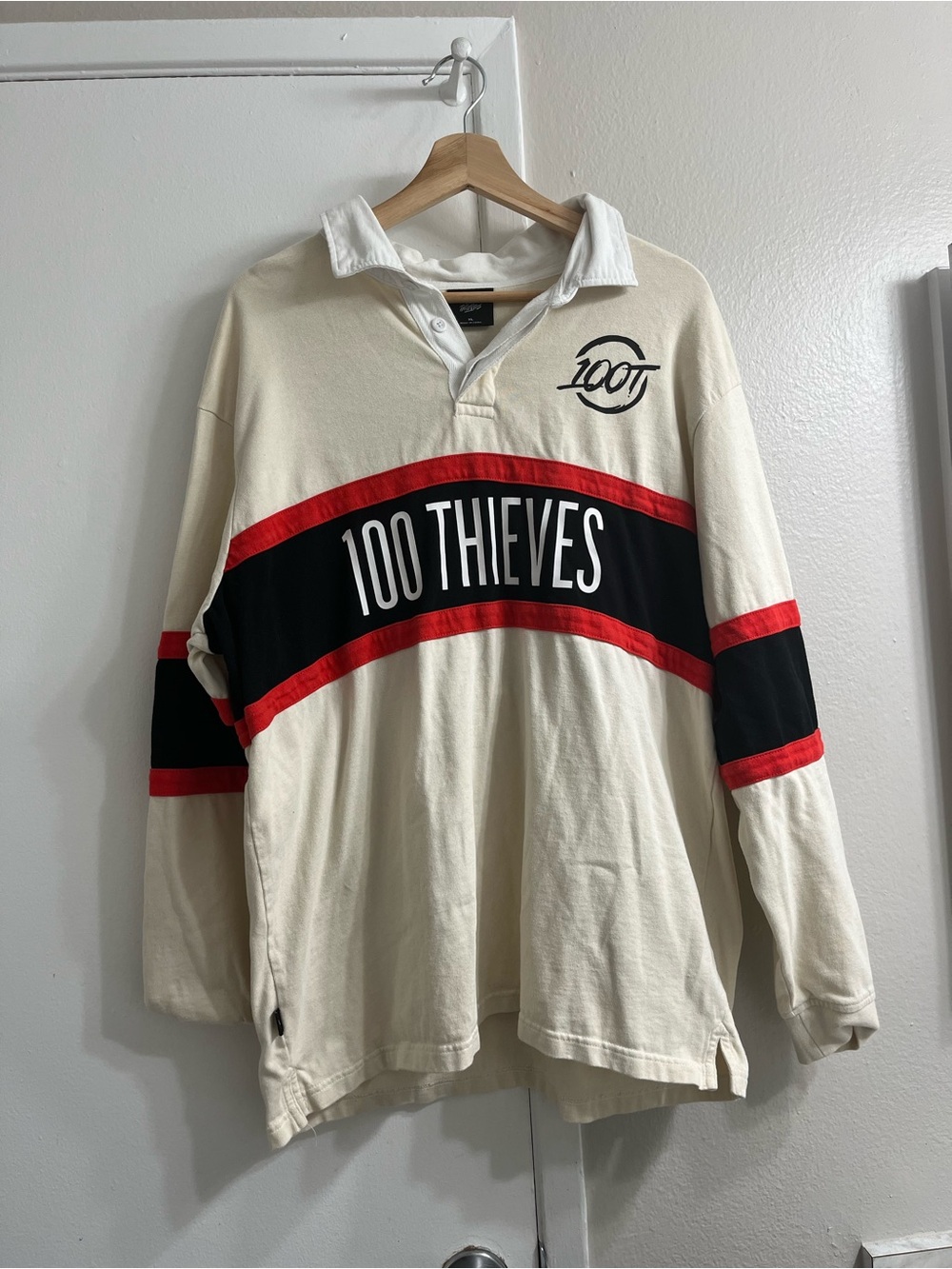 100 Thieves Men’s Cream Rugby Shirt with Black & Red Stripes